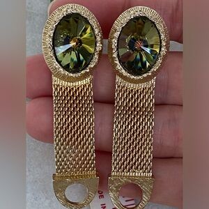 Goldtone cuff links with olive/golden crystal face